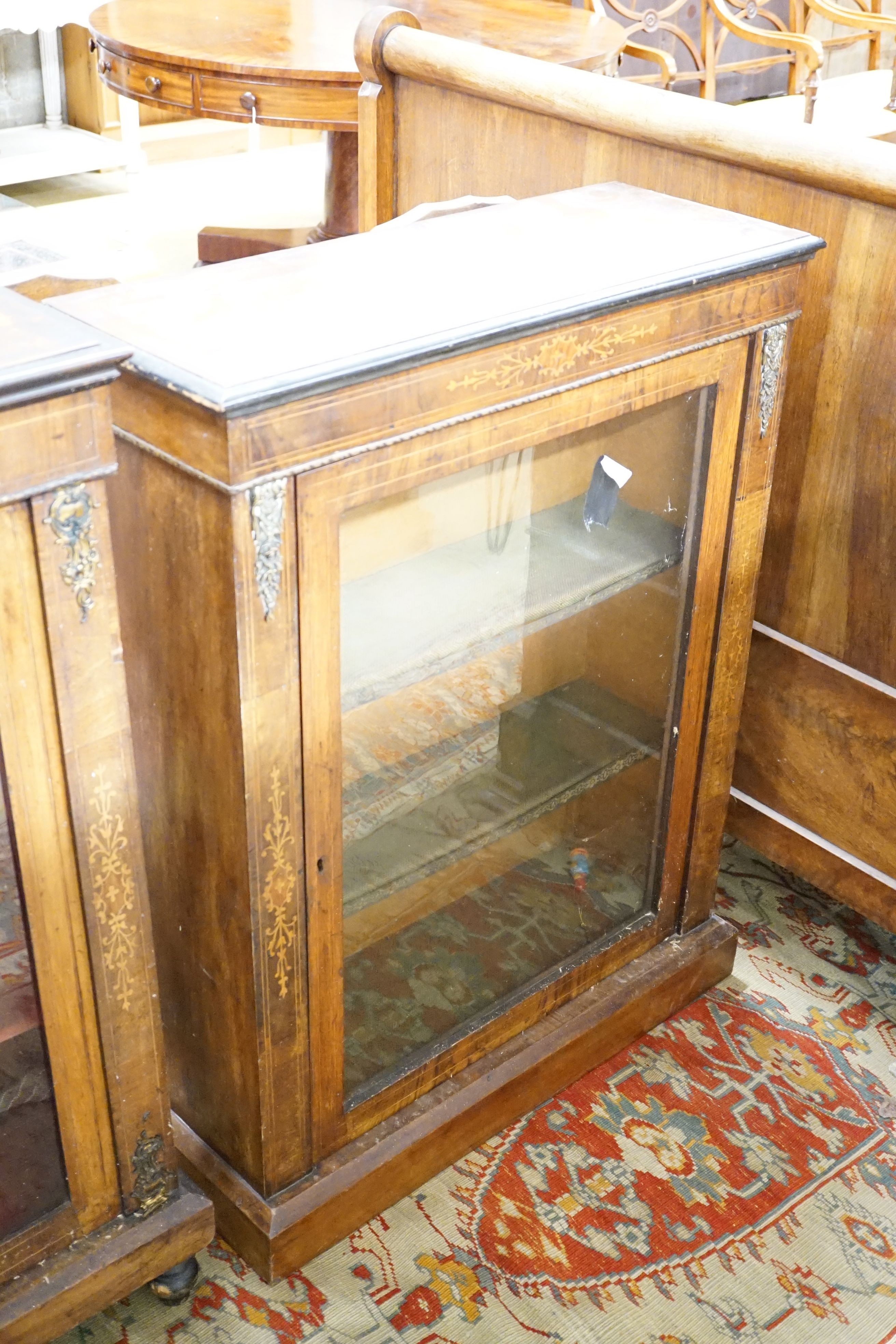 Two similar Victorian walnut and marquetry pier cabinets, the largest 76.5 cm wide, 29 cm deep, 103 cm high
